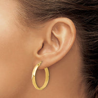 Load image into Gallery viewer, 10K Polished Twisted Round Hoop Earrings
