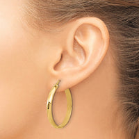 Load image into Gallery viewer, 10K Polished Twisted Round Hoop Earrings
