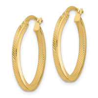 Load image into Gallery viewer, 10K Polished and Textured Oval Hoop Earrings
