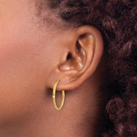 Load image into Gallery viewer, 10K Polished Twist Oval Hoop Earrings
