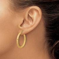 Load image into Gallery viewer, 10k Polished and Textured Twisted Tube Hoop Earrings
