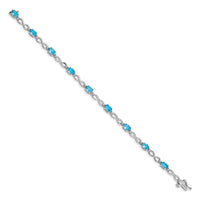 Load image into Gallery viewer, 10k White Gold Blue Topaz and Diamond Infinity Bracelet
