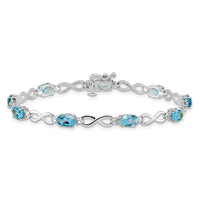 Load image into Gallery viewer, 10k White Gold Blue Topaz and Diamond Infinity Bracelet
