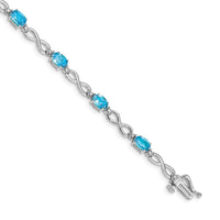 Load image into Gallery viewer, 10k White Gold Blue Topaz and Diamond Infinity Bracelet
