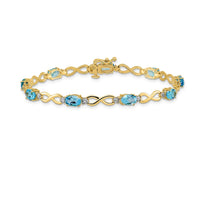 Load image into Gallery viewer, 14k Complete Oval Swiss Blue Topaz and Diamond Infinity Link 7 inch Bracelet
