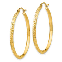Load image into Gallery viewer, 14k Knife Edge D/C Hollow 2.5x35mm Hoop Earrings
