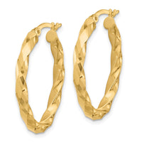 Load image into Gallery viewer, 14K Polished and D/C Twisted Oval Hoop Earrings
