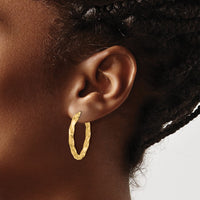 Load image into Gallery viewer, 14K Polished and D/C Twisted Oval Hoop Earrings
