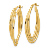 Load image into Gallery viewer, 14k Polished and Textured Triple Oval Twist Hoop Earrings
