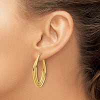 Load image into Gallery viewer, 14k Polished and Textured Triple Oval Twist Hoop Earrings

