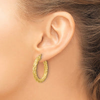 Load image into Gallery viewer, 14k Polished and Textured Twisted Circle Hoop Earrings
