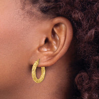 Load image into Gallery viewer, 14k Polished and Textured Twisted Tube Hoop Earrings
