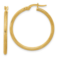 Load image into Gallery viewer, 14k Polished and Textured Twisted Tube Hoop Earrings

