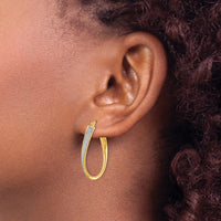Load image into Gallery viewer, 14K Polished Glimmer Infused Oval Twist Hoop Earrings
